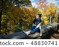 Young smiling woman resting in New York city, USA. 48830741