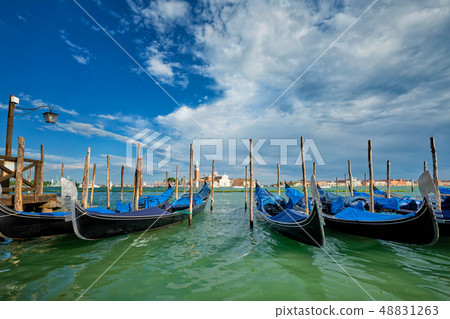 Gondolas and in lagoon of Venice by San Marco square. Venice, Italy 48831263