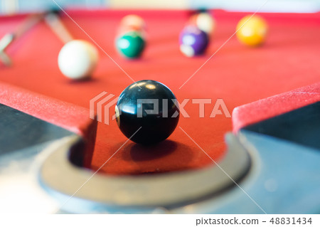 black ball of snooker on snooker table 48831434