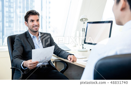 Handsome Hispanic businessman as a boss Handsome Hispanic businessman as a boss 48831740
