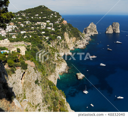 Capri island, panoramic view with Faraglioni 48832040