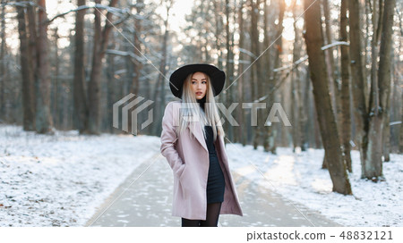 Young beautiful woman in fashionable stylish hat Young beautiful woman in fashionable stylish hat 48832121