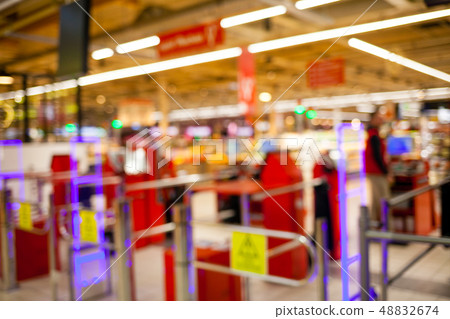 Blurred background of the supermarket. Blurred background of the supermarket. 48832674