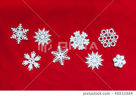 Snowflakes on a red background Snowflakes on a red background 48832884