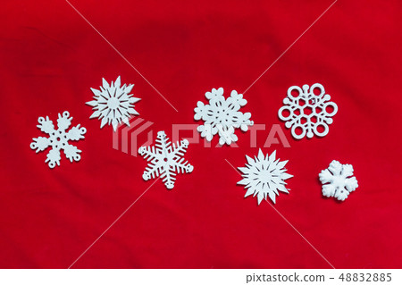 Snowflakes on a red background Snowflakes on a red background 48832885