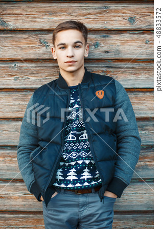 Stylish young man standing Stylish young man standing 48833572