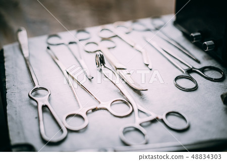 Old medical and surgical instruments 48834303