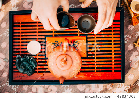 Table for the Traditional tea ceremony utensils, chinese teapot and teacup Table for the Traditional tea ceremony utensils, chinese teapot and teacup 48834305