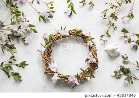 Spring wreath with flowers. Creative flat lay. View from above. 48834849
