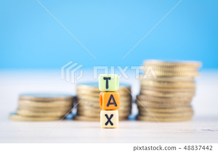 colorful cube with word TAX on wooden table 48837442
