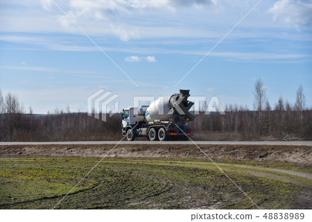 Car mixer goes on road in spring Car mixer goes on road in spring 48838989