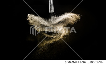 golden powder splash and brush for makeup artist 48839202