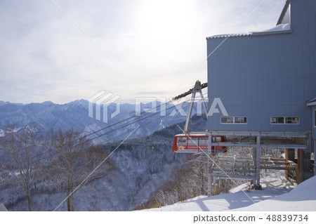 Scenic view of the slopes of the Yuzawa Plateau in winter and ropeway Scenic view of the slopes of the Yuzawa Plateau in winter and ropeway 48839734