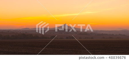 The silhouette of Hazmburk Castle at sunrise.Czech The silhouette of Hazmburk Castle at sunrise.Czech 48839876