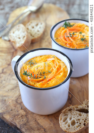 Vegetable carrot soup and bread, two portions Vegetable carrot soup and bread, two portions 48844821