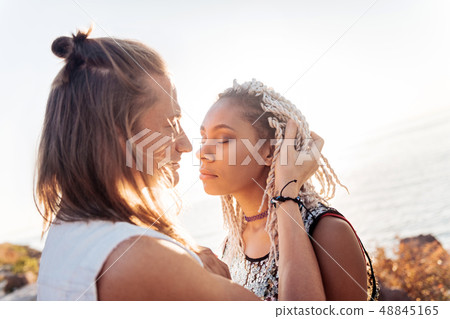 Loving man looking at his appealing stylish woman traveling together Loving man looking at his appealing stylish woman traveling together 48845165