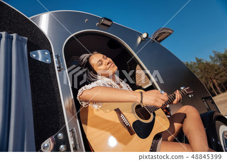 African-American musician feeling amazing playing the guitar African-American musician feeling amazing playing the guitar 48845399