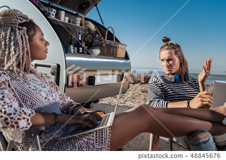 African-American woman with white dreadlocks laughing drinking beer 48845676