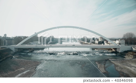 Aerial shot of the Tanaro river and bridge in Alessandria, Italy 48846098
