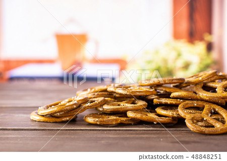 Mini salted pretzels with books on window Mini salted pretzels with books on window 48848251