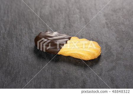 Lazy cookie with chocolate on grey stone 48848322