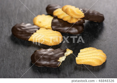 Lazy cookie with chocolate on grey stone 48848326