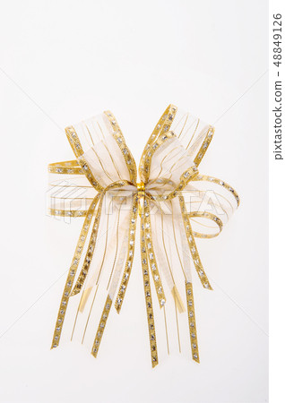 Gold ribbon with bow isolated on white background Gold ribbon with bow isolated on white background 48849126