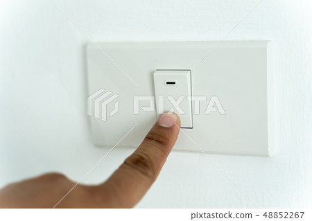 Close up of man finger is turning on or off on Close up of man finger is turning on or off on 48852267
