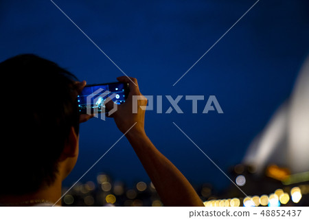 Man shooting night scene of Sydney Man shooting night scene of Sydney 48852437