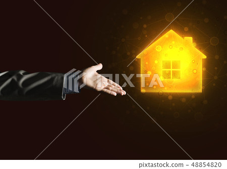 Conceptual image with hand pointing at house or main page icon on dark background Conceptual image with hand pointing at house or main page icon on dark background 48854820