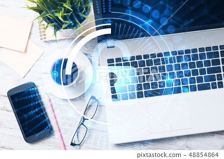 Business workplace with laptop coffee cup and security concept on screen 48854864