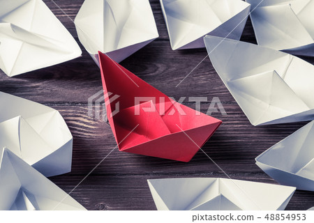 Business leadership concept with white and color paper boats on Business leadership concept with white and color paper boats on 48854953