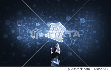 Conceptual image with hand pointing at house or main page icon on dark background 48855817