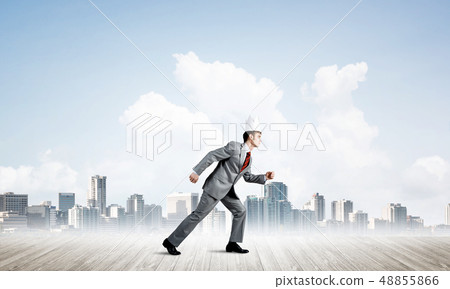 King businessman in elegant suit running and modern cityscape at background 48855866