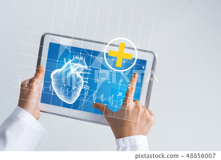 Close of female doctor hands working with tablet pc computer 48856007