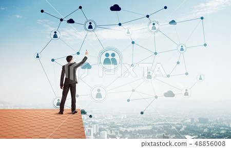 Businessman on house roof presenting networking and connection concept. Mixed media 48856008