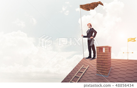 Young businessman with flag presenting concept of leadership. Mi 48856434