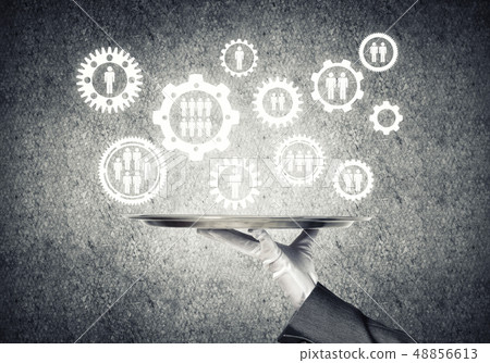 Waiter hand with white gloves holding silver plate full of social media communication icons 48856613