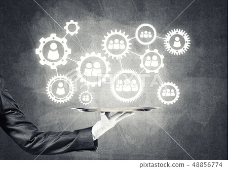 Waiter hand with white gloves holding silver plate full of social media communication icons Waiter hand with white gloves holding silver plate full of social media communication icons 48856774