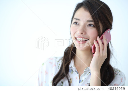 A smartphone and a young lady A smartphone and a young lady 48856959