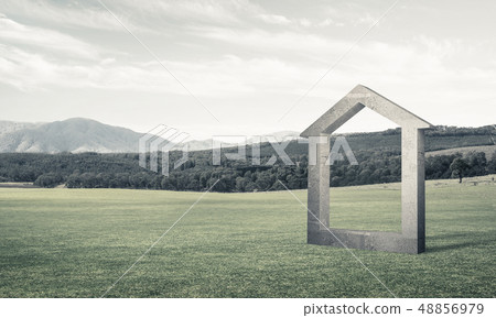 Conceptual background image of concrete home sign on green grass Conceptual background image of concrete home sign on green grass 48856979