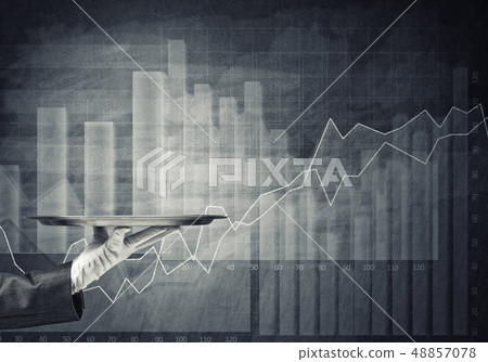 Waiter hand in white glove presenting empty tray and dynamics of diagram at background Waiter hand in white glove presenting empty tray and dynamics of diagram at background 48857078