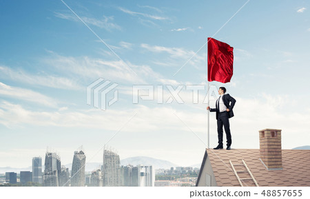 Young businessman with flag presenting concept of leadership. Mi 48857655