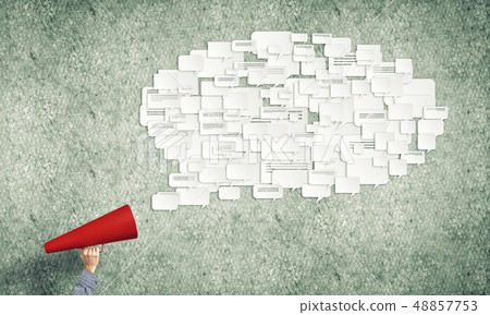 Hand of man holding red paper trumpet and speech cloud 48857753