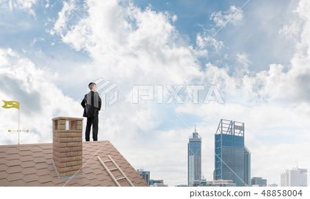 Mister boss on brick roof with arms akimbo. Mixed media 48858004