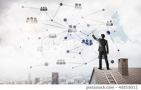 Businessman on house roof presenting networking and connection c Businessman on house roof presenting networking and connection c 48858011