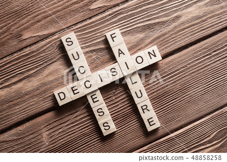 Conceptual keywords on wooden table with elements of game making crossword Conceptual keywords on wooden table with elements of game making crossword 48858258