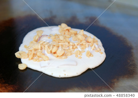 Osaka's specialty squid, dough and tempura before baking Osaka's specialty squid, dough and tempura before baking 48858340
