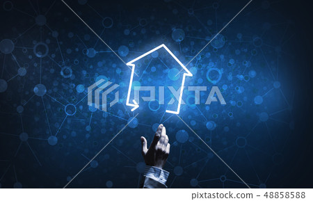 Conceptual image with hand pointing at house or main page icon on dark background 48858588