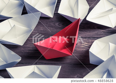 Business leadership concept with white and color paper boats on 48858628